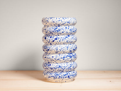 Blue and white ceramic vase on wooden surface