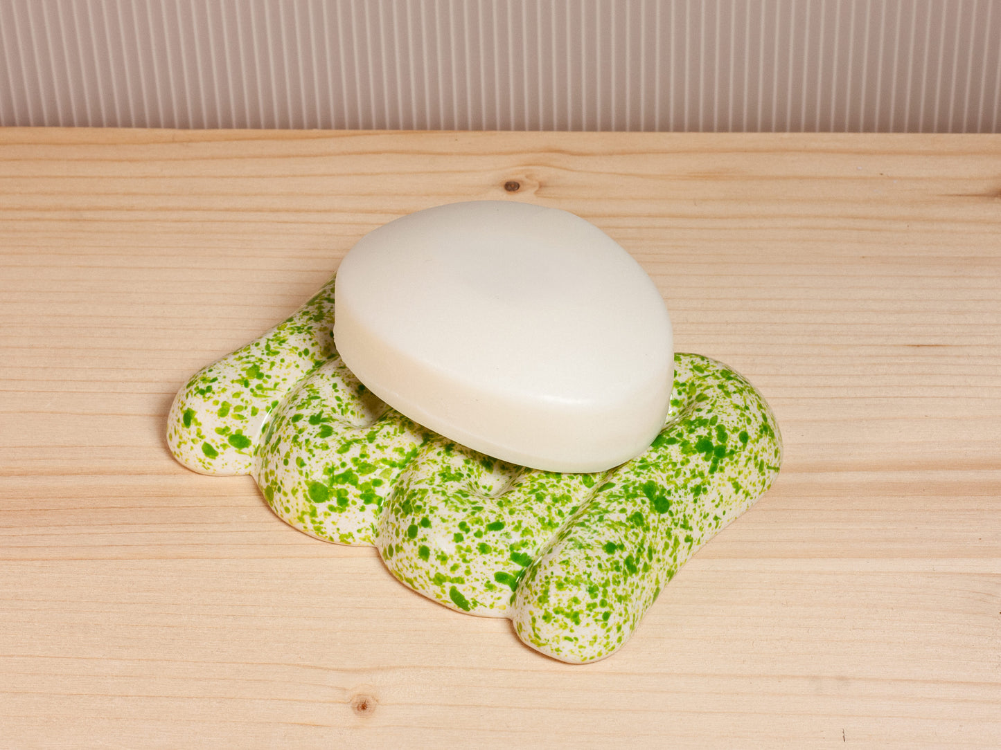 Green and white ceramic soap dish