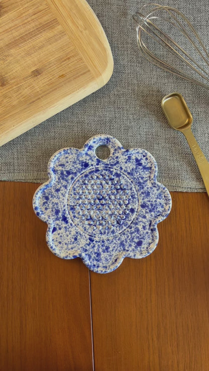 Video of ceramic garlic grater being used to grate a clove of garlic